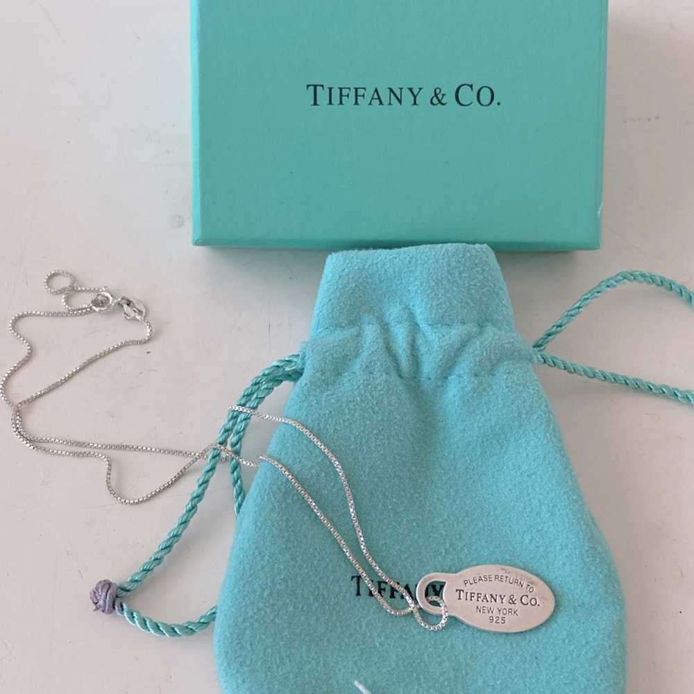 Tiffany & Co sterling silver “please return to Tiffany &Co new york pendant.